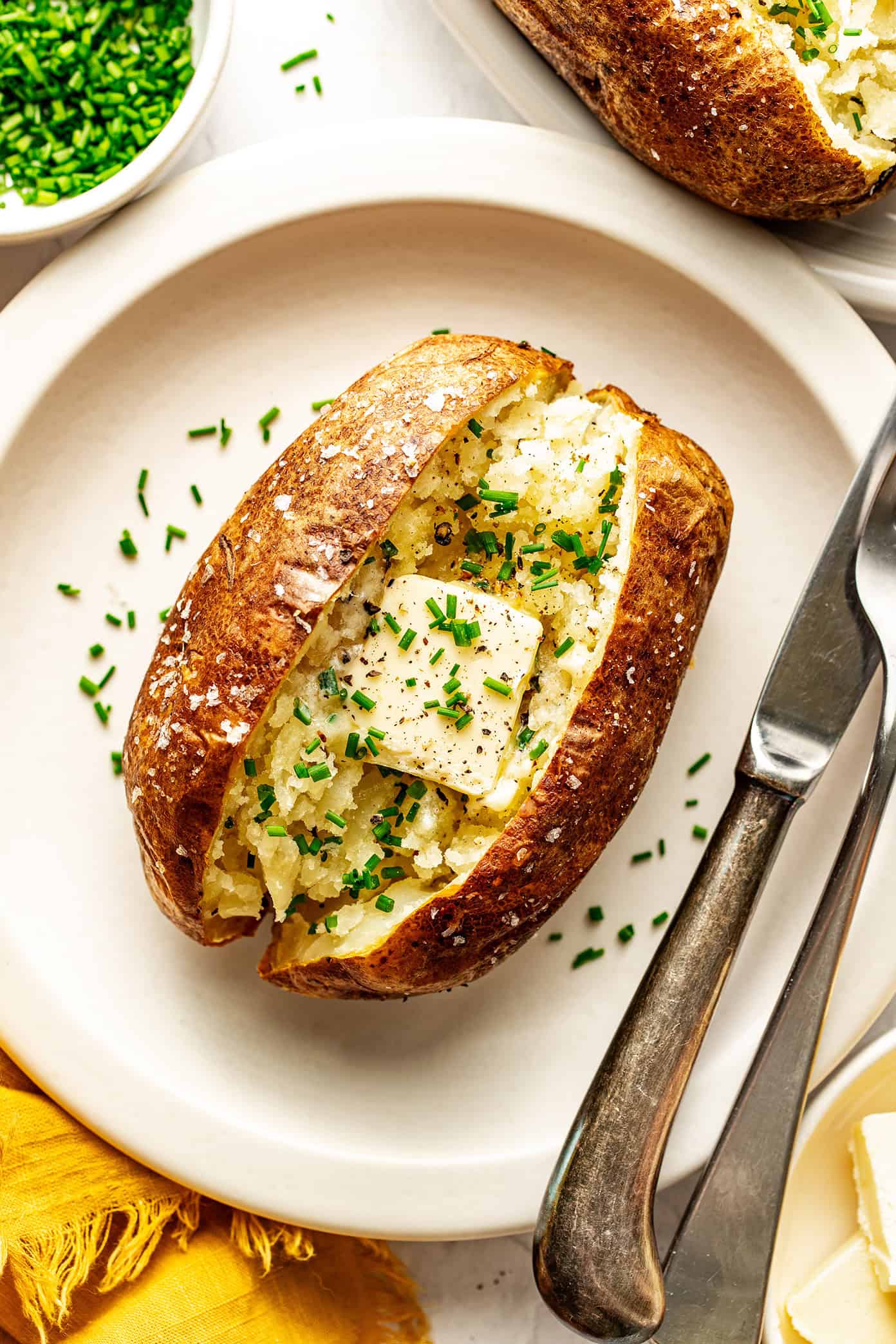 air fryer baked potato with butter and chives
