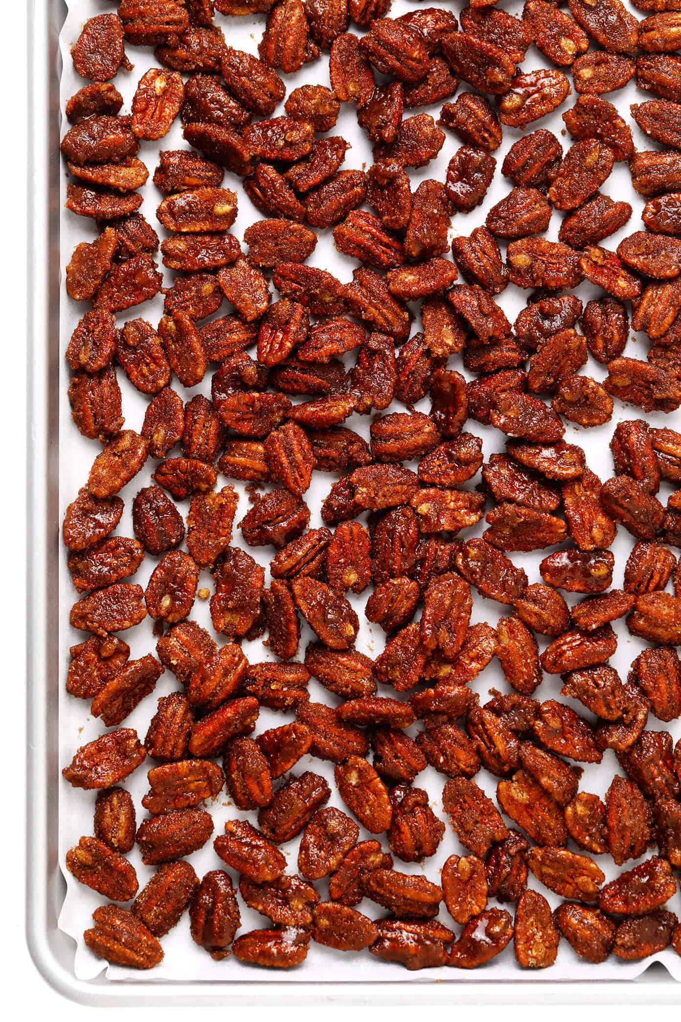 My favorite classic candied pecans recipe is made with a crunchy cinnamon sugar coating that is perfectly seasoned with a hint of sea salt and cayenne. Easy to make with 7 ingredients, naturally gluten-free, and perfect for topping salads, casseroles, yogurt, ice cream and more! | gimmesomeoven.com #candied #pecans #nuts #dessert #salad #topping #glutenfree #candy Prepping candied pecans for baking