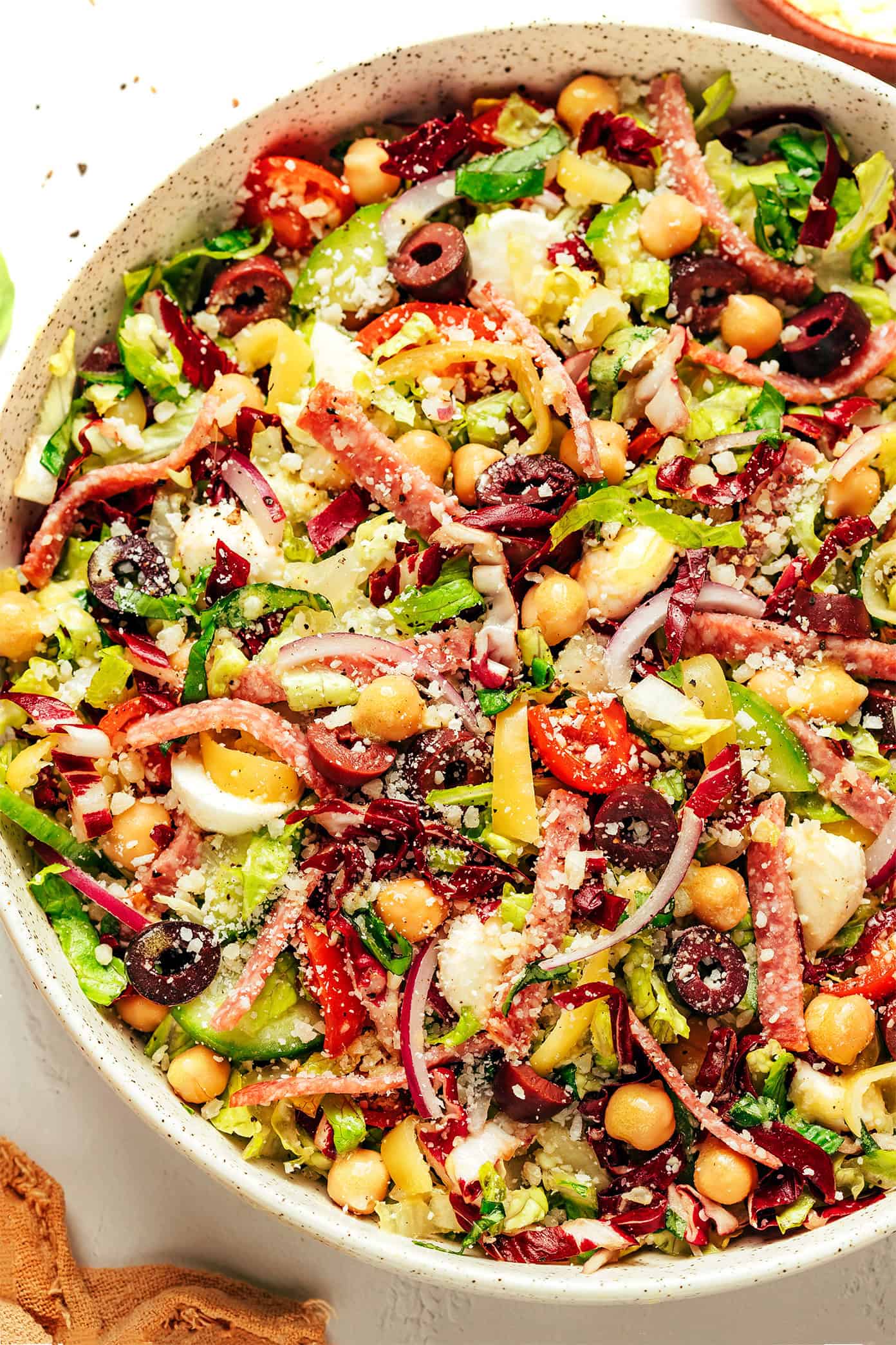 Italian chopped salad with salami and chickpeas