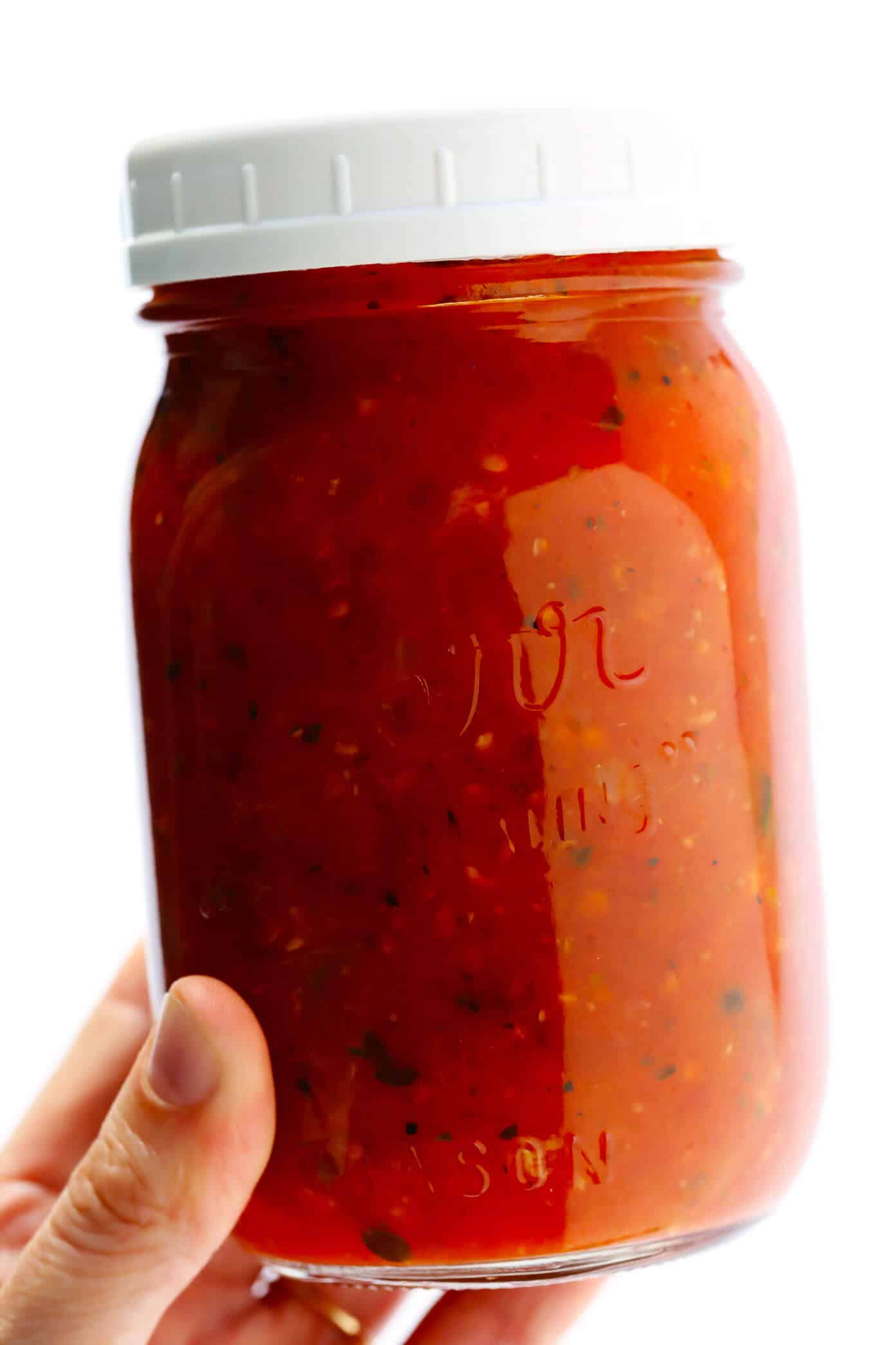 This homemade marinara sauce recipe is easy to make, naturally gluten-free and vegan, and slow-simmered with the BEST tomato, basil and garlicky flavors. Serve it with spaghetti, meatballs, pizza, chicken, mussels, eggplant Parmesan, subs, or whatever sounds good! | gimmesomeoven.com #marinara #sauce #tomato #pasta #glutenfree #vegetarian #vegan #healthy #mealprep #freezermeal #dinner Spaghetti Sauce Recipe