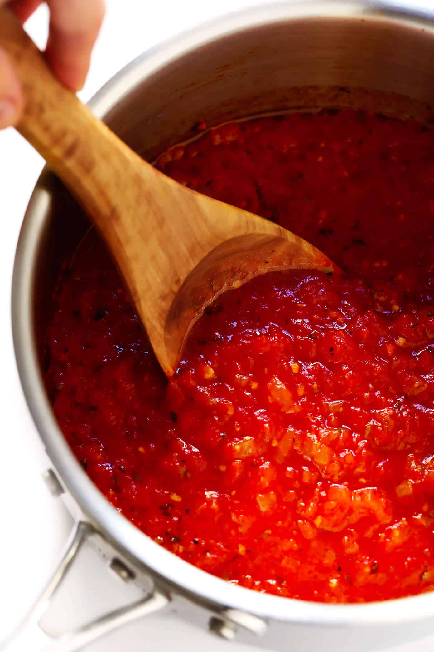 This homemade marinara sauce recipe is easy to make, naturally gluten-free and vegan, and slow-simmered with the BEST tomato, basil and garlicky flavors. Serve it with spaghetti, meatballs, pizza, chicken, mussels, eggplant Parmesan, subs, or whatever sounds good! | gimmesomeoven.com #marinara #sauce #tomato #pasta #glutenfree #vegetarian #vegan #healthy #mealprep #freezermeal #dinner Homemade Marinara Sauce Recipe