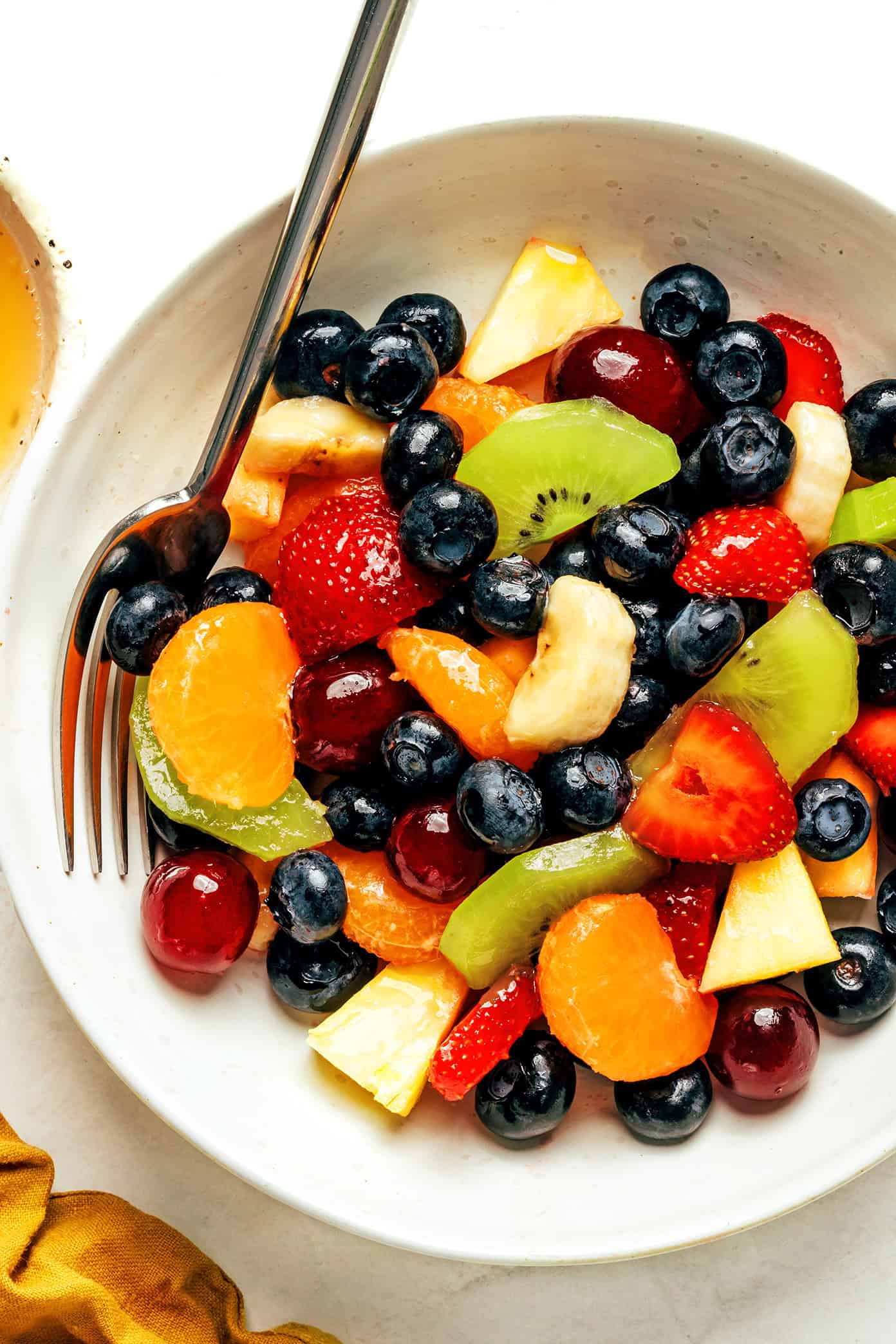 bowl of fruit salad with fork