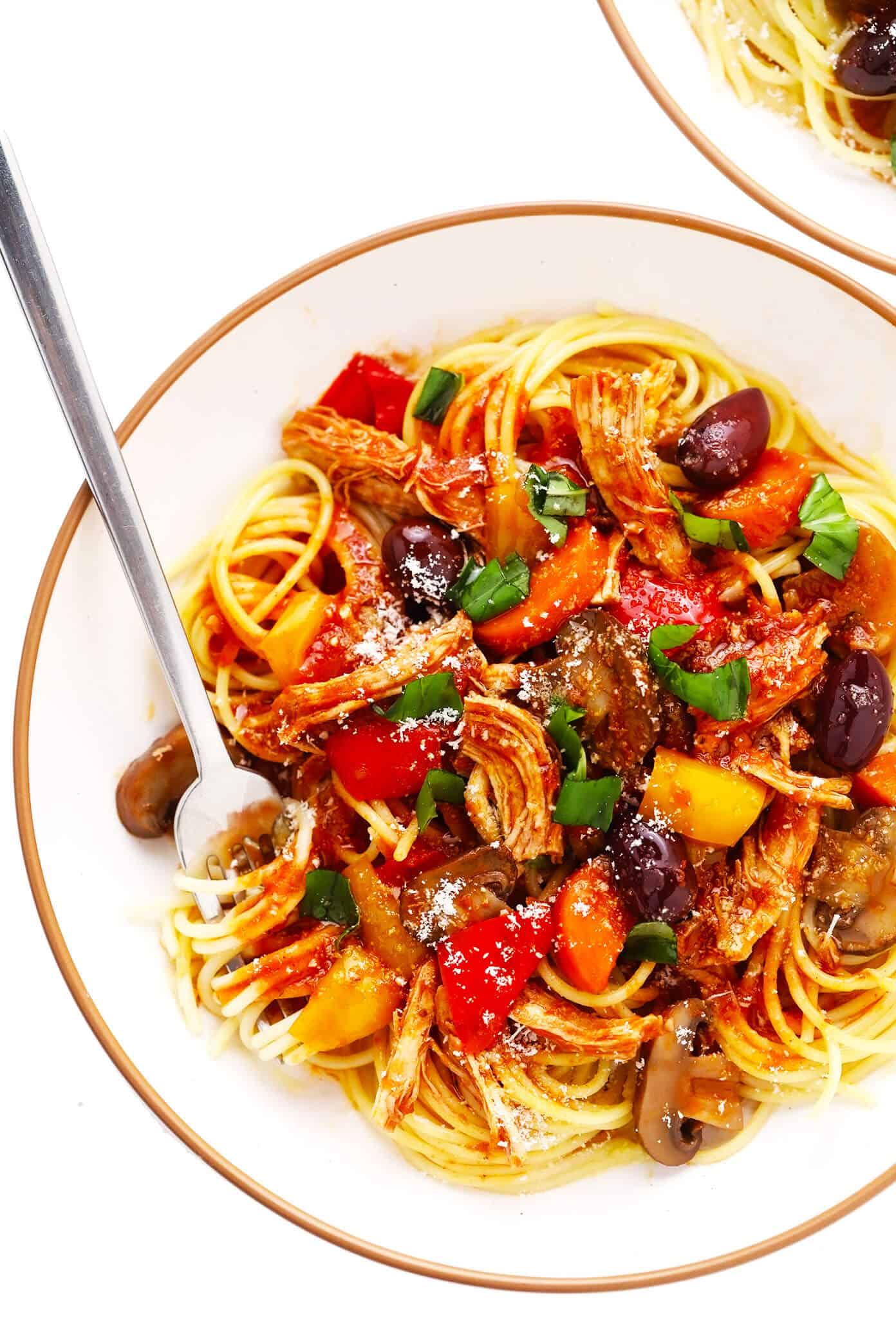 This chicken cacciatore recipe is easy to make with your choice of veggies and simmered in a flavorful garlic-herb tomato sauce. Easy to make in either the Instant Pot, Crock-Pot or on the stovetop and delicious served over pasta or polenta. Always a great dinner recipe for Italian night! | gimmesomeoven.com Chicken Cacciatore Pasta