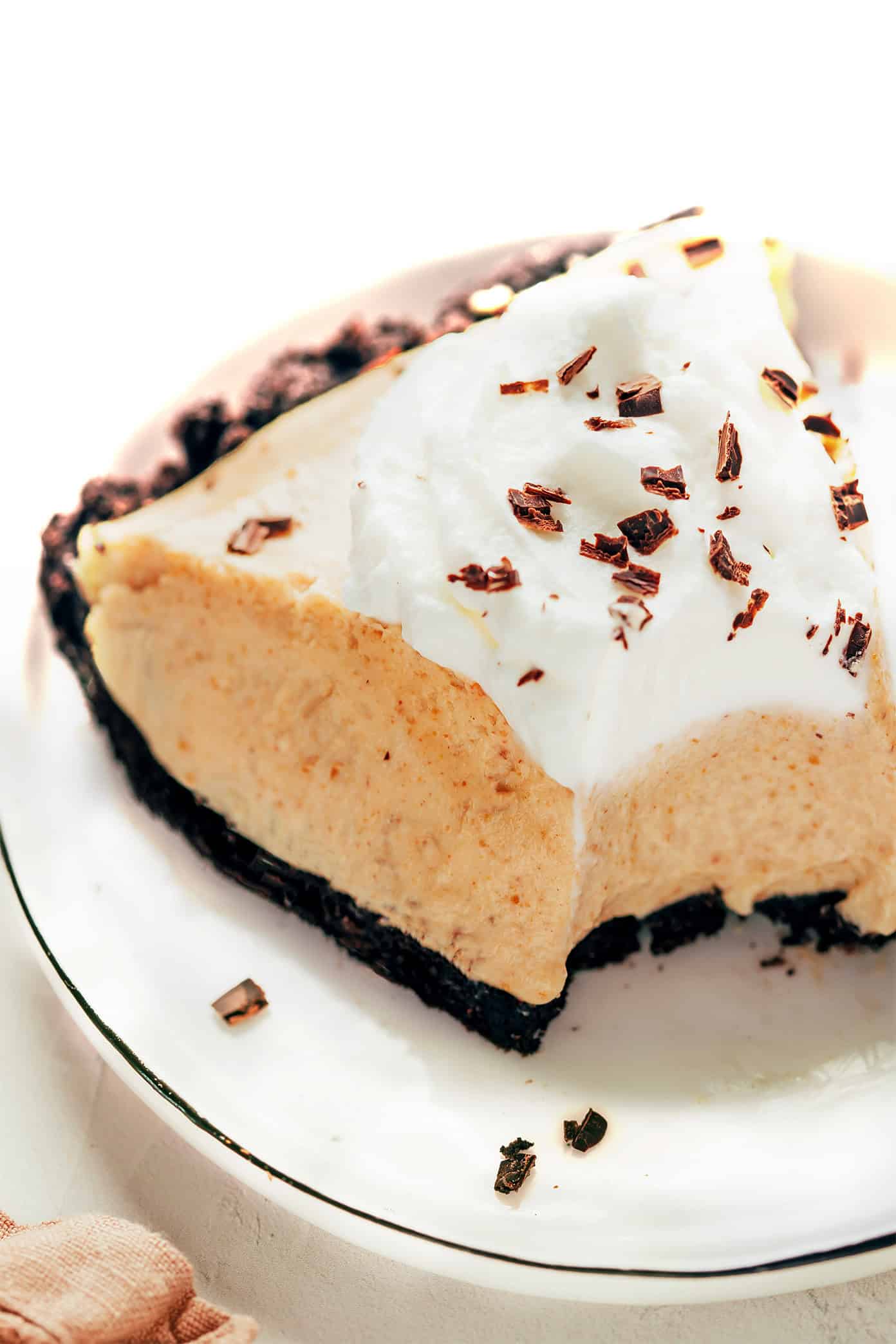 Slice of peanut butter pie with whipped cream