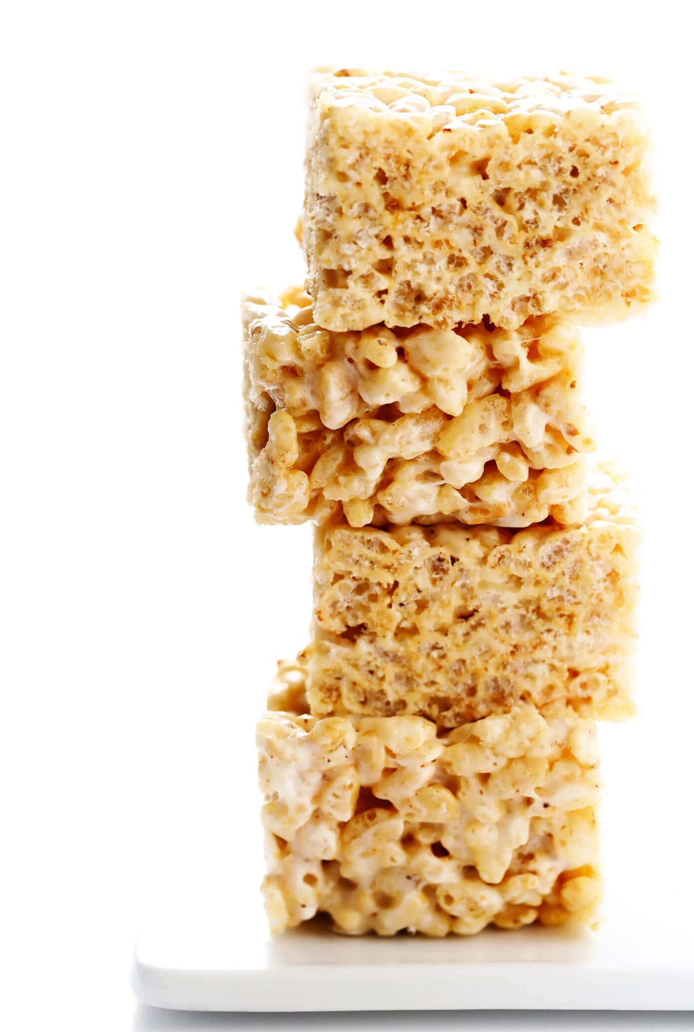 The classic 3-ingredient Rice Krispie Treats recipe is kicked up an irresistible notch with brown butter, toasted marshmallows, a splash of bourbon (if you'd like), and an extra pinch of sea salt. Always a delicious and nostalgic easy dessert recipe! | gimmesomeoven.com #ricekrispies #treats #cereal #dessert #vegan #treat #marshmallow Next-Level Rice Krispie Treats
